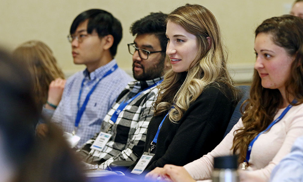 Grad students listening to a presentation